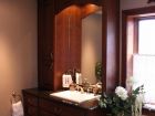 Bathroom Sink with Large Mirror and Cabinets